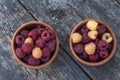 Red and yellow raspberries in a cup Royalty Free Stock Photo