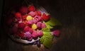 Red and yellow raspberries and strawberries in metal plate Royalty Free Stock Photo