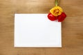 Red and yellow roses on wooden background. Blank sheet of paper Royalty Free Stock Photo