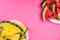 Red and Yellow Seedless Watermelon Sliced on Plates,Pastel Background,Flat Lay