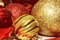 Red and yellow shimmering christmas baubles, retro photo filter