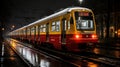 a red and yellow train on the tracks at night Royalty Free Stock Photo