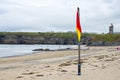 Red and yellow warning flag at beach Royalty Free Stock Photo