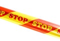 Warning tape with STOP sign isolated on white background