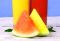 Red and yellow watermelon with juice, mint