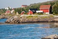 Red and yellow wooden fishing cabins in Norway Royalty Free Stock Photo