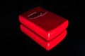 Red zippo lighter with reflection on shiny black background