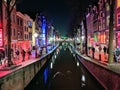 Red zone lights, canals and houses of Amsterdam city, in Holland, Netherlands Royalty Free Stock Photo