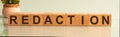 REDACTION word written on wood block. Redaction text on wooden table for your desing