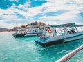 Boats, turquoise water and white sand beach, Redang Island, Malaysia