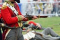 Redcoat firing Musket in re-enactment Royalty Free Stock Photo