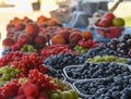 Redcurrants, raspberries, gooseberries, billberries and other fruit and vegetables for sale at local farmers market Royalty Free Stock Photo