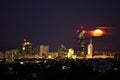 Full moon rises over downtown Vienna