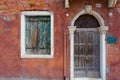 Reddish rustic exterior of a home in burano italy