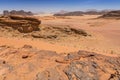 Reddish sand and rock landscapes in the desert of Wadi Rum, southern Jordan