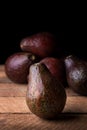 Avocados, ripe fruits on table top