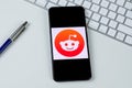 Reddit app logo on a smartphone screen Royalty Free Stock Photo