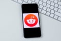 Reddit app logo on a smartphone screen Royalty Free Stock Photo