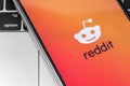 Reddit logo on the screen smartphone.