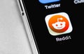 Reddit mobile app icon on screen smartphone