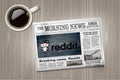 Reddit news in newspaper on a table near a coffee cup Royalty Free Stock Photo