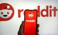 Reddit social news company logo displayed on a smartphone Royalty Free Stock Photo