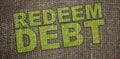 REDEEM debt words written on burlap canvas. Business concept