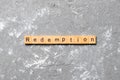 Redemption word written on wood block. redemption text on cement table for your desing, concept Royalty Free Stock Photo