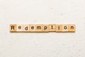 redemption word written on wood block. redemption text on cement table for your desing, concept Royalty Free Stock Photo