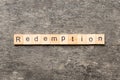 redemption word written on wood block. redemption text on cement table for your desing, concept Royalty Free Stock Photo