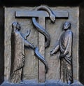 The redemptive death of Christ depicted in the emblem of the bronze serpent, door of the Grossmunster church in Zurich Royalty Free Stock Photo