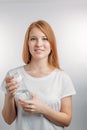 Redhair beautiful girl holding water bottle.