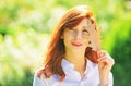 Redhair woman enjoying autumn weather. Beautiful fall time in nature.