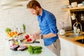 Redhair young man cooking food Royalty Free Stock Photo