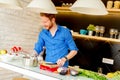 Redhair young man cooking food Royalty Free Stock Photo