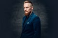 Redhead bearded hipster male dressed in a blue jacket. Royalty Free Stock Photo