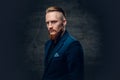 Redhead bearded hipster male dressed in a blue jacket. Royalty Free Stock Photo