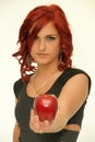 Redhead beauty with red apple