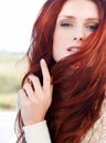 Redhead beauty, woman and face outdoor with hair care and red haircolor with cosmetics and makeup. Female, person, model Royalty Free Stock Photo