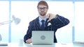 Redhead Businessman Doing Thumbs Down gesture at Work Royalty Free Stock Photo