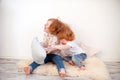 Redhead children fight with pillows Royalty Free Stock Photo
