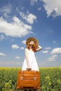 Redhead enchantress with suitcase Royalty Free Stock Photo