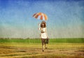 Redhead enchantress with umbrella and suitcase at spring country Royalty Free Stock Photo