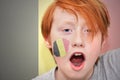 Redhead fan boy with belgian flag painted on his face Royalty Free Stock Photo