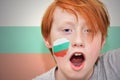 Redhead fan boy with bulgarian flag painted on his face Royalty Free Stock Photo