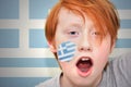Redhead fan boy with greek flag painted on his face Royalty Free Stock Photo