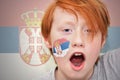 Redhead fan boy with serbian flag painted on his face Royalty Free Stock Photo