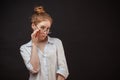 Redhead female model in glasses posing on black background Royalty Free Stock Photo