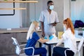 Redhead female Patient getting shot at hospital or clinic. Doctor injecting young woman Royalty Free Stock Photo