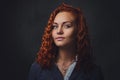 Redhead female supervisor dressed in an elegant suit. Royalty Free Stock Photo